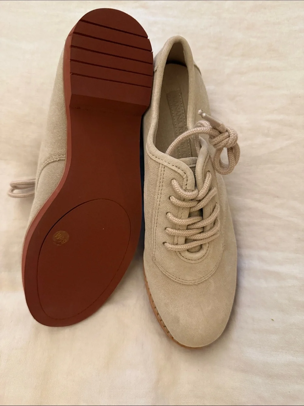 Beige Suede Lace-Up loafers.